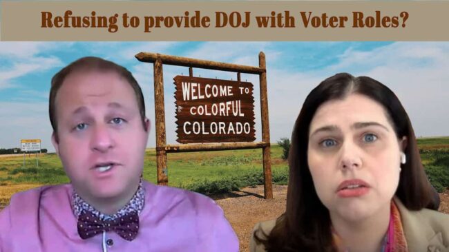 Refusing DOJ 1. Protest against DOJ voter roles refusal in Colorado with two individuals expressing concern, symbolic welcoming sign in the background.