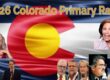 Diverse group of candidates and officials at the 2026 Colorado Primary Race, with the Colorado state flag in the background, highlighting political engagement and election process.